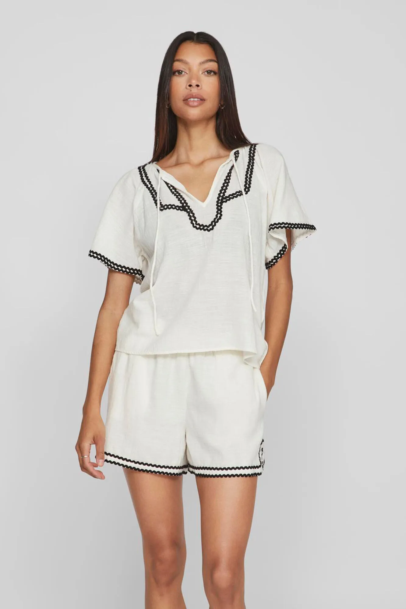 Vila Blusa manga corta con ribetes
